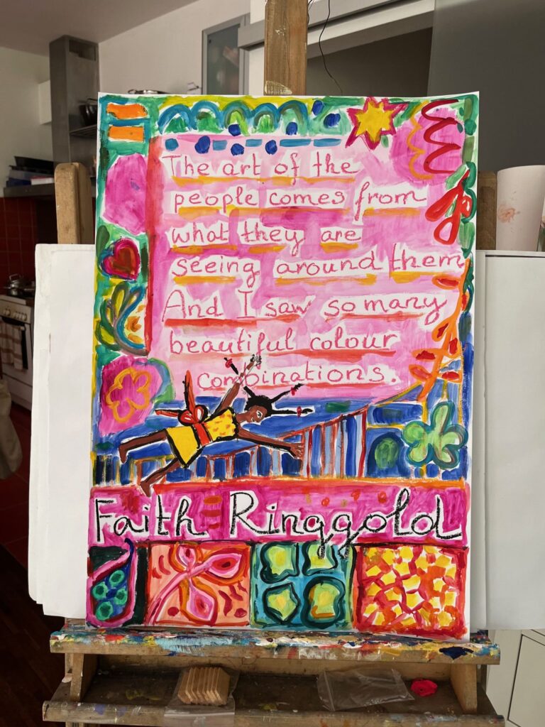 Inspirational Poster on easel with an inspirational quote by Faith Finggold